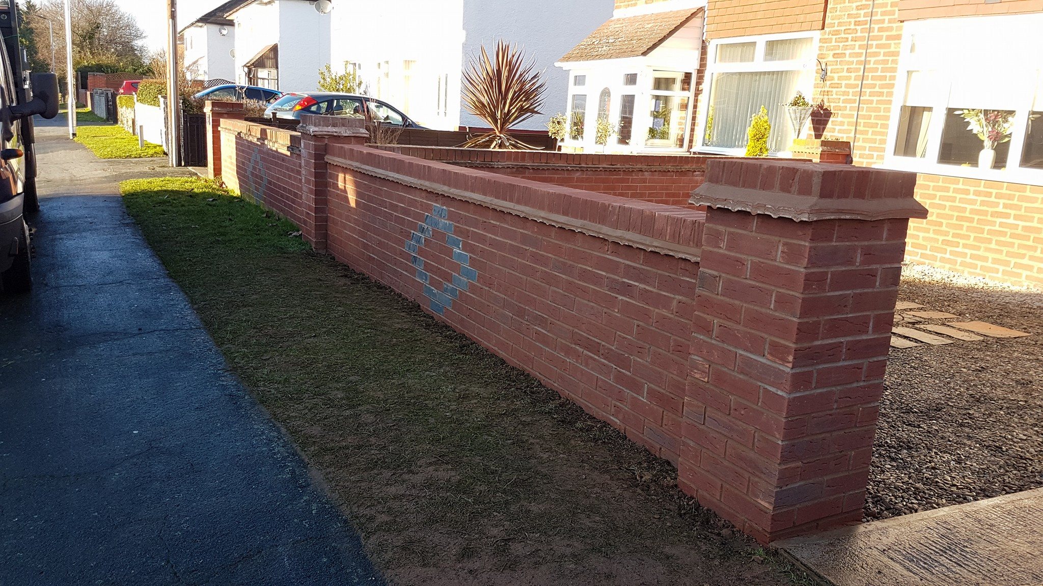 Garden wall and paving at Hinton