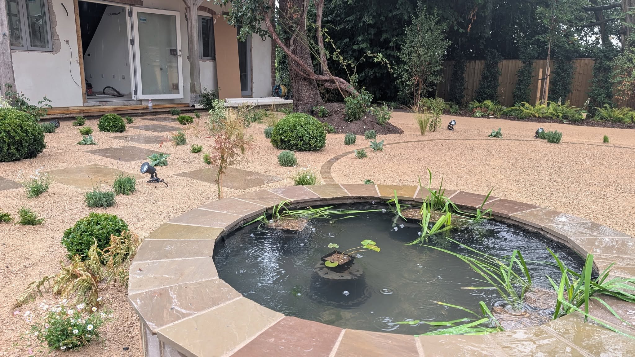 Stone-edged garden pond